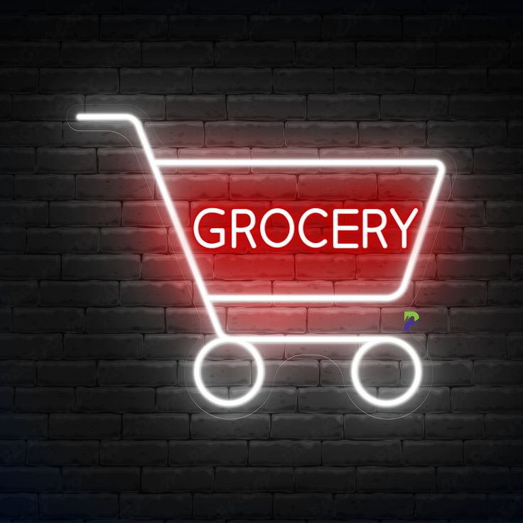 Illuminated grocery cart neon sign against a dark brick wall, highlighting fresh food and beverage options.