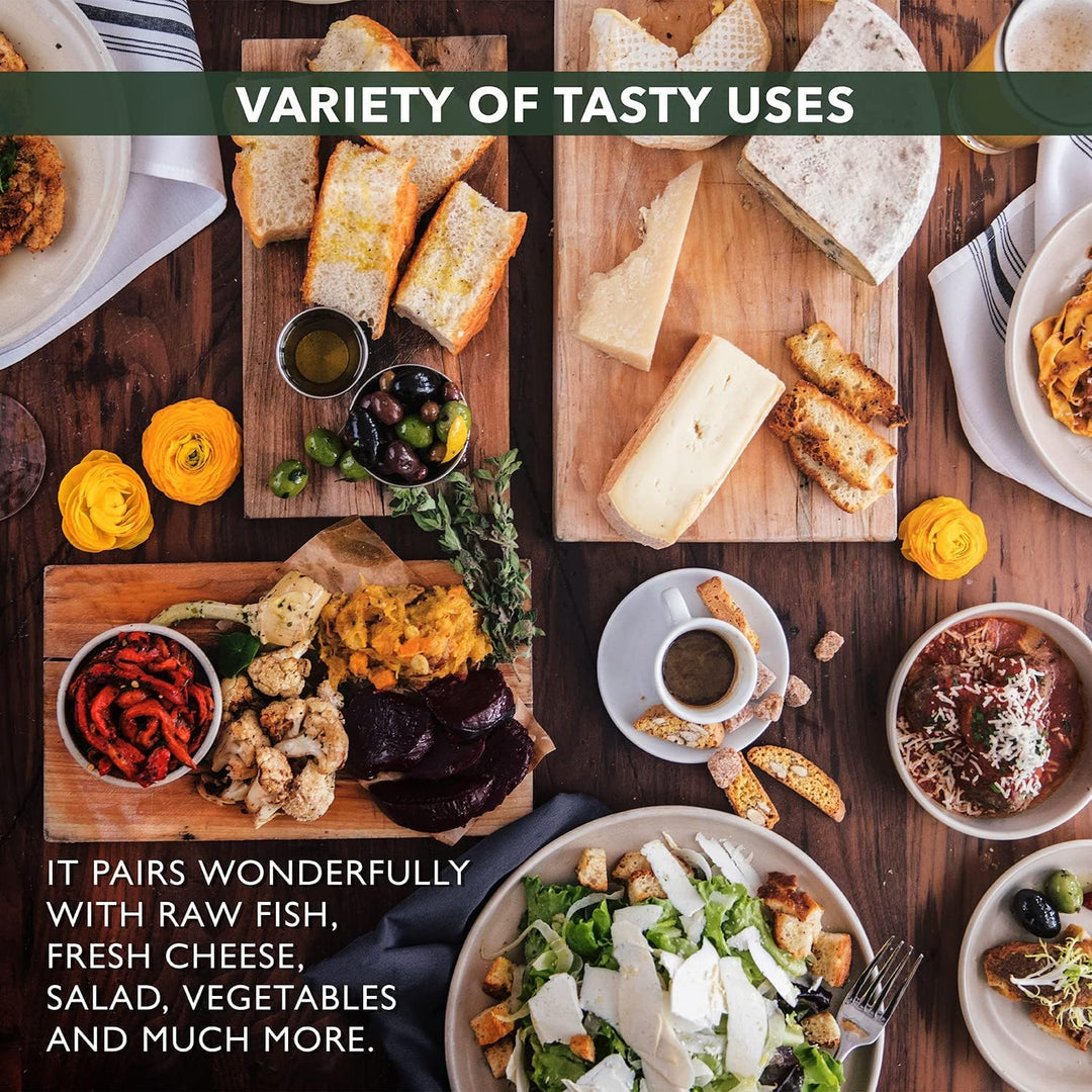 A spread of fresh dishes including cheese, salad, and vegetables, showcasing a variety of tasty uses for olive oil.