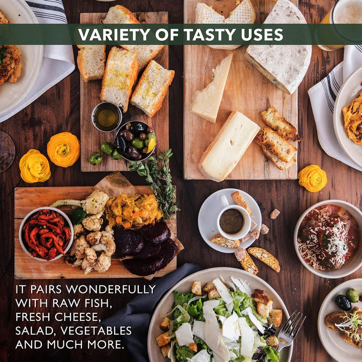 A spread of fresh dishes including cheese, salad, and vegetables, showcasing a variety of tasty uses for olive oil.