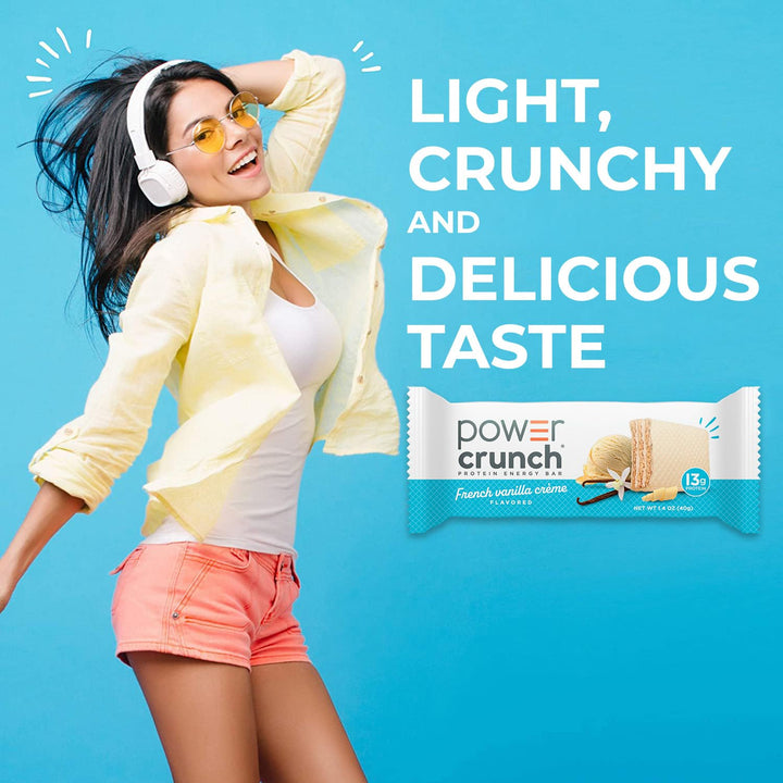 Woman in yellow jacket and shorts with Power Crunch bar on blue background