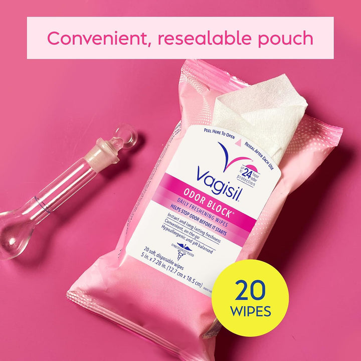 Vagisil Odor Block daily freshening wipes in a pink resealable pouch, shown with a clear glass bottle on a pink background and a yellow '20 WIPES' badge.