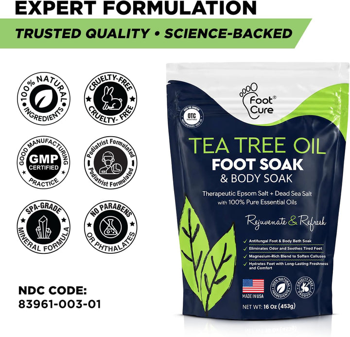 A package of Foot Cure Tea Tree Oil Foot Soak & Body Soap shown on a white background with marketing text and quality seals. The pouch is dark blue with green and white graphics and text.