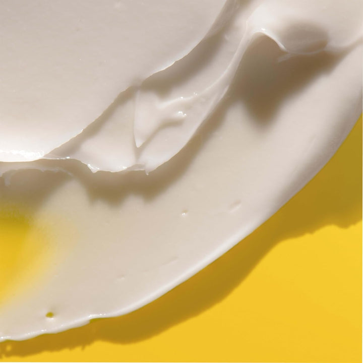 Close-up of white cream on a yellow background