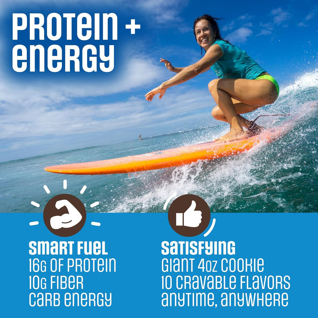 Promotional graphic for a protein powder product featuring a woman crouching on an orange surfboard in the ocean under a blue sky. Large text reads 'PROTEIN + energy' and includes product claims like 'Smart Fuel' and 'Satisfying' with icons and flavor details.