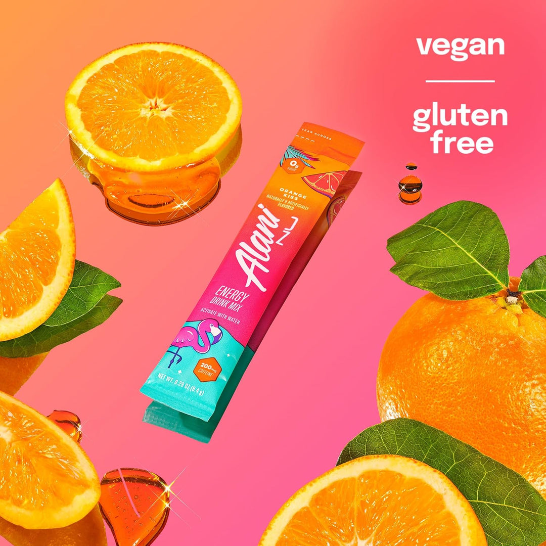 A packaged snack stick labeled 'Alor' Energy Flavour Stick, shown on a bright pink and orange background with sliced oranges, whole oranges, and green leaves. Text in the top right reads 'vegan gluten free'.