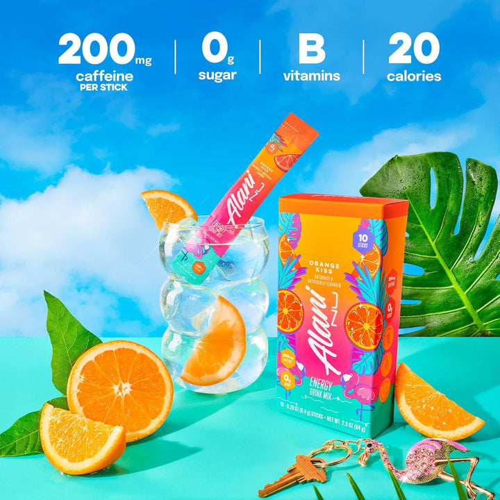 Alani Nu energy stick with packaging, oranges, and tropical leaves on a bright blue background